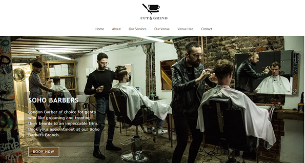 Inside the best barber shop, three barbers skillfully attend to customers amid exposed brick walls and mirrors. A "Book Now" button beckons from the vibrant barber shop website, inviting you to reserve your next grooming experience.