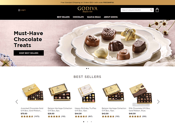 The Godiva website homepage dazzles with assorted chocolates elegantly displayed on a plate. A section dedicated to best sellers features enticing product images and ratings, making it one of the top candy sites for chocolate lovers.