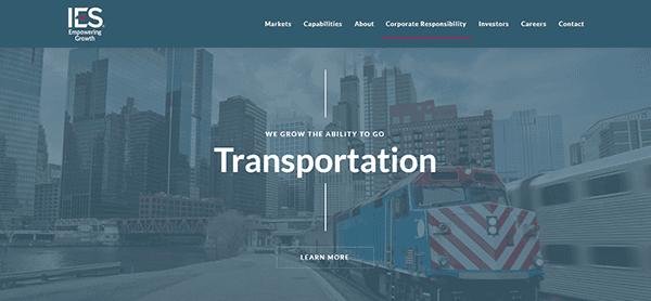 Train on tracks with city skyline in background, seamlessly connecting business hubs. Text overlay highlights the transportation capabilities of a company, powered by a commercial electrician network ensuring reliable infrastructure to support your journey.
