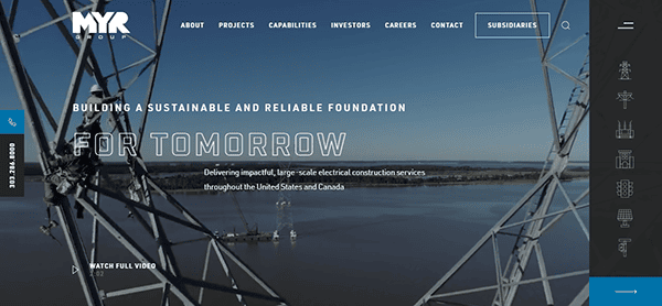 Website screenshot of MYR Group, one of the best commercial electrician websites. It shows a construction site over water with text overlay: "Building a Sustainable and Reliable Foundation for Tomorrow." Includes navigation menus on the top and side.