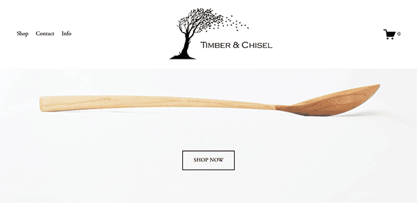 Displayed on a minimalist carpenter website, the wooden spoon takes center stage. Featuring a logo with a tree silhouette and a "Shop Now" button below, it invites you to explore the best carpenter's craftsmanship through options for shop, contact, and info.