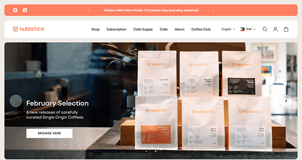 The website homepage showcases six bags of coffee on a counter, labeled as "February Selection" by Yardstick. With a sleek navigation menu and social media icons at the top, it stands out among the best cafe websites for its design and user experience.