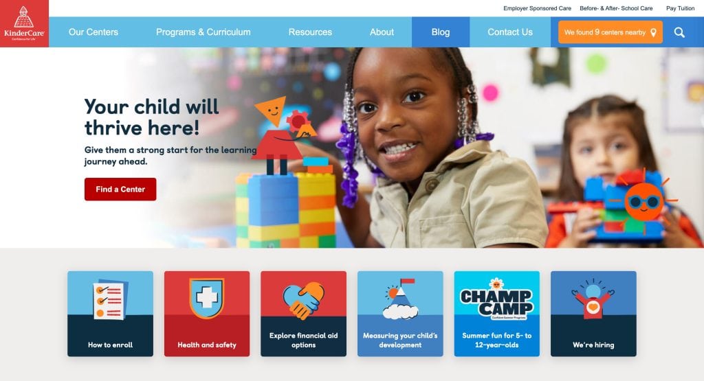 A young girl smiles while playing with colorful building blocks in a classroom. The text reads, Your child will thrive here! Discover why we're featured among the best daycare websites, with vibrant buttons and menu options shown below.