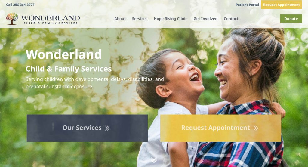 A smiling woman holds a laughing young child outdoors, surrounded by sunlit greenery. Text overlays promote Wonderland Child & Family Services, highlight the best daycare options, and invite you to request an appointment or view services.