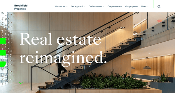 Modern office interior with a wooden staircase, lush plants, and a person walking down. Text overlay reads, "Commercial Real Estate Websites: Reimagined." Brookfield Properties logo at the top.