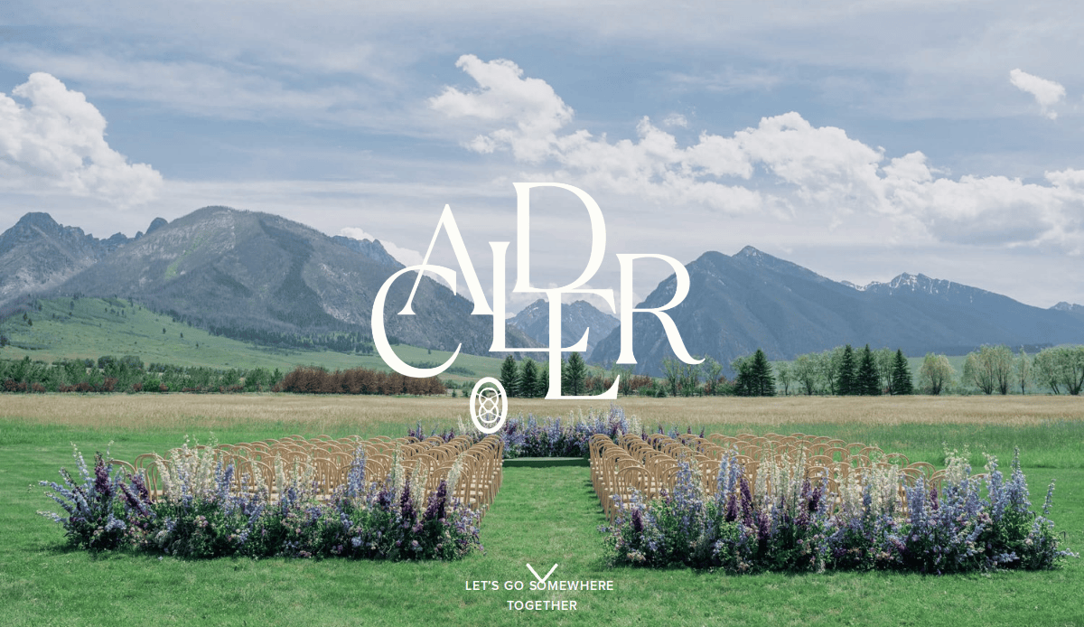Rows of chairs and a flower-lined aisle are set up for an outdoor ceremony on a grassy field, framed by mountains and trees under a partly cloudy sky. Large white text reads ADLER, perfect inspiration for top event planners websites.