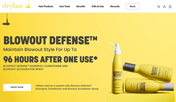 Drybar advertisement featuring Blowout Defense products on a yellow background, with text highlighting 96-hour style retention after one use—perfect for hair stylists looking to ensure their clients leave with lasting results.