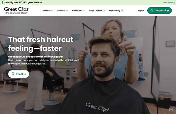 Man with barber cape in salon chair, hair stylist behind him, in a Great Clips salon. Text highlights online check-in for the best hair stylists, simplifying your visit.