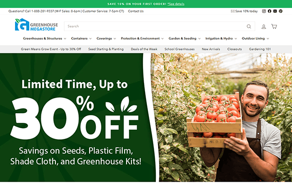 A man holds a crate of tomatoes in a greenhouse, showcasing the best quality produce. Text advertises "Limited Time, Up to 30% Off" on garden supplies from Greenhouse Megastore. Visit our website for the best deals!.