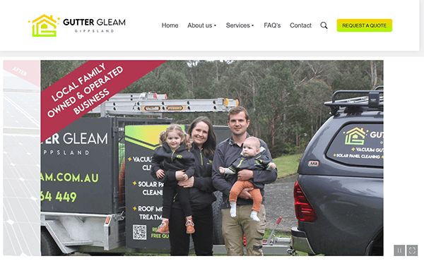 A family of four, sporting matching logo jackets, stands proudly before Gutter Gleam vehicles with a forest backdrop. A red banner reads, "Local Family Owned & Operated Business." Discover why we are considered the best gutter cleaner in town.