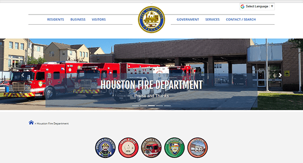 The Houston Fire Department webpage showcases fire trucks parked at a station, complete with the department logo and a sleek navigation menu. It's an example of one of the best fire department websites, highlighting top-notch design elements that enhance user experience.