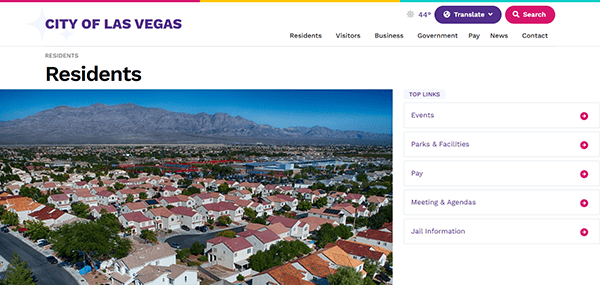 Aerial view of a suburban neighborhood in Las Vegas features the city website header with navigation options for residents and links to Fire Department resources.