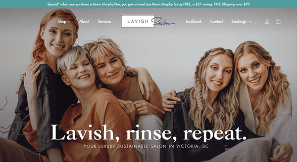 Four women with varied hairstyles and coloration pose closely, smiling at the camera. The Lavish Salon logo and tagline "Lavish, rinse, repeat" are displayed, highlighting a sustainable salon in Victoria, BC known for hosting the best hair stylists.