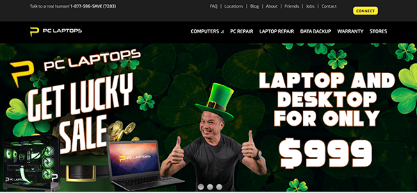 Promotional banner for a "Get Lucky Sale" by PC Laptops featuring laptops and desktops for $999. A man wearing a leprechaun hat gives a thumbs-up, surrounded by shamrocks. Explore the best computer repair websites to keep your new device in top shape!.