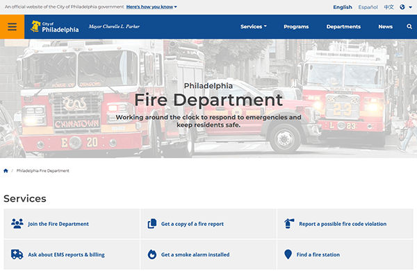 Explore the Philadelphia Fire Department webpage, where a striking fire truck background and city logo guide you through an array of service links. Discover why it's one of the best fire department websites with intuitive navigation options and stellar design.
