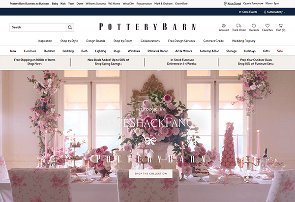The Pottery Barn website homepage features floral decorations, a pink-themed dining setup, and a banner introducing a collaboration with LoveShackFancy. Discover elegant furniture pieces that make Pottery Barn one of the best furniture websites for stylish home transformations.