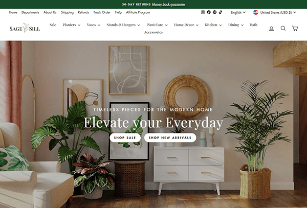 Discover a stylish living room adorned with plants, a white sideboard, and a round mirror. Explore new arrivals and home pieces from Sage and Sill, your go-to destination for the best furniture online.