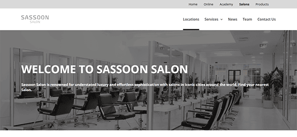 Interior view of Sassoon Salon with several styling chairs and mirrors, highlighting modern and understated luxury decor, perfect for those seeking the best hair stylist experience. Text overlay reads, "Welcome to Sassoon Salon.