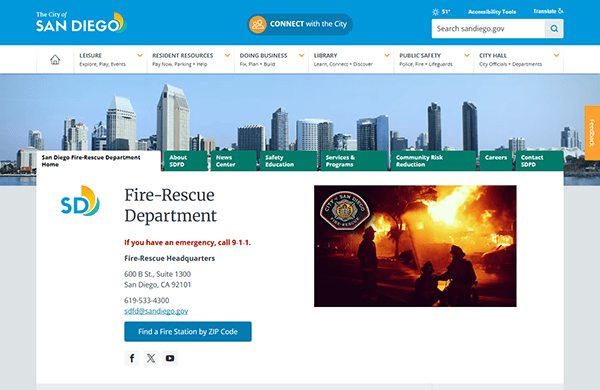 Explore the San Diego Fire-Rescue Department webpage, one of the best fire department websites. It features a city skyline, emergency contact info, and an image of brave firefighters combating a blaze.