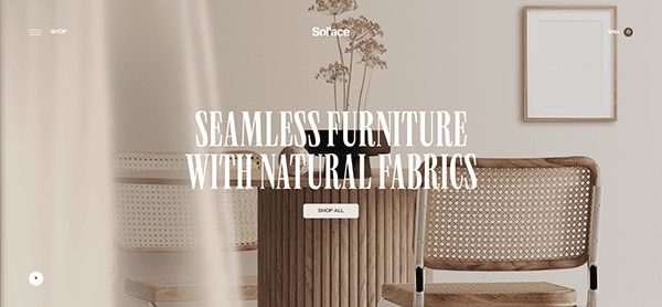 Modern dining area with wooden chairs and a beige wall. Large text reads: "Seamless Furniture with Natural Fabrics." Discover the best furniture websites for a minimalistic style that transforms your space effortlessly.