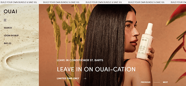 Woman holding a bottle of Ouai leave-in conditioner, text reads "Leave in on Ouai-cation - Limited Time Only." Discover what top hair stylists recommend for vacation-ready hair.