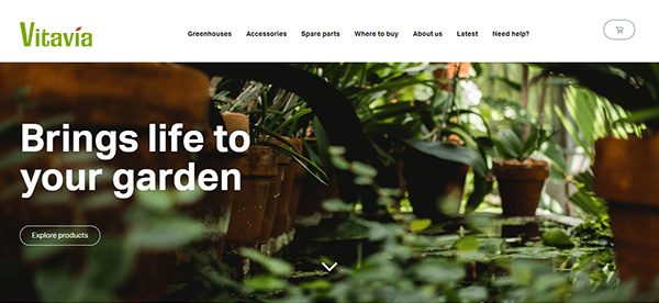 Explore Vitavia Greenhouses' homepage, the best greenhouse website showcasing lush potted plants and elegant greenhouses. "Brings life to your garden.