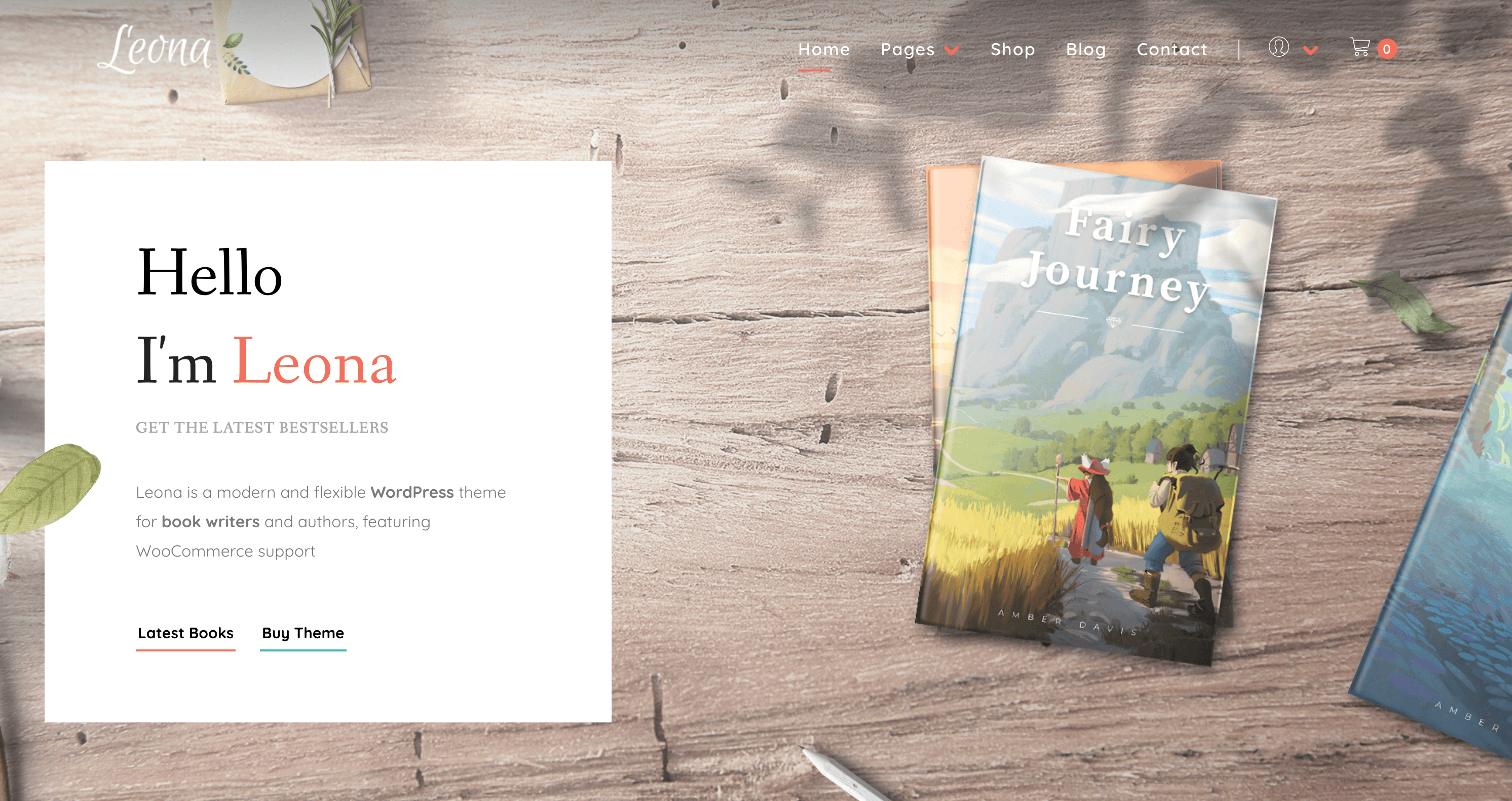 Wooden desk with brochures, including "Fairy Journey." To the left, a card promoting the Leona WordPress theme for book writers.