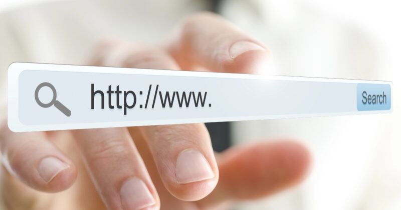 A person points at a floating search bar displaying "http://www." with a search button on the right, ready to connect seamlessly with their desired WordPress or Wix domain.