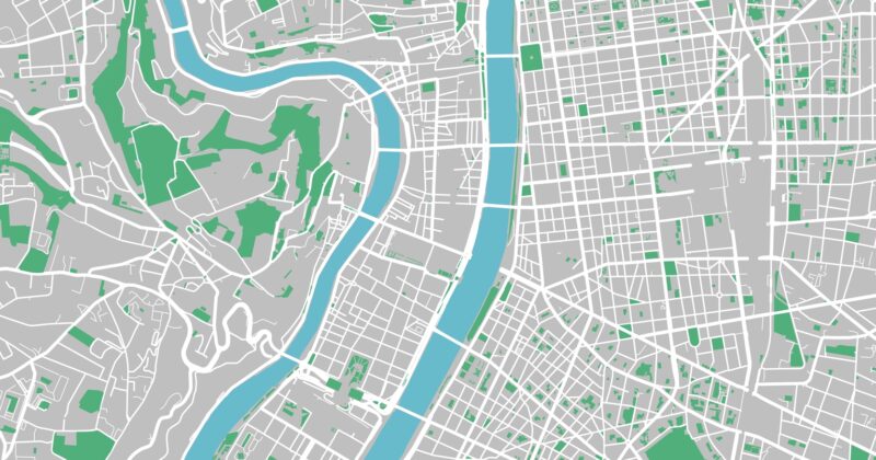 A simplified city map showing a river running vertically through the center highlights City Pages, with green areas for parks and gray zones marking urban development—illustrating the local reach of service area businesses.