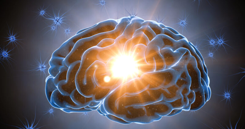 Illustration of a human brain with a bright light at its center, surrounded by neurons and a glowing, dark background—symbolizing the power of personalizing Buyer Personas for effective marketing strategies.