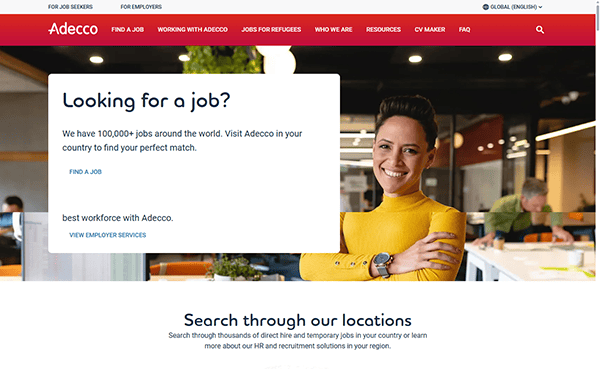 A woman in a yellow sweater stands smiling with arms crossed in a modern office. The website, one of the best recruiting websites, promotes Adecco job search services, with a search bar for job locations below.