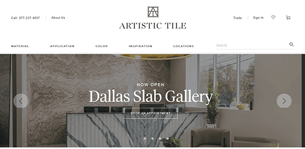 Homepage of Artistic Tile, one of the best tile websites, featuring a banner for the Dallas Slab Gallery opening, with marble slabs and a modern reception area pictured.