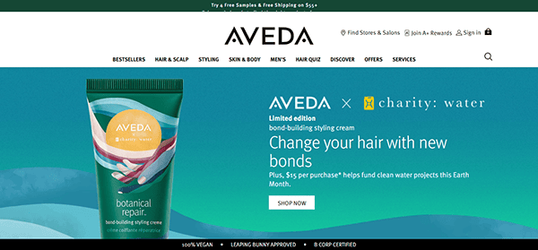 Aveda’s salon website design showcases a botanical repair bond-building styling cream and highlights a charity: water partnership banner for Earth Month donations.