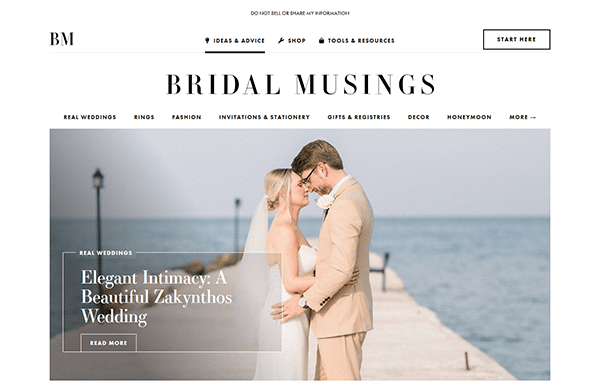 A bride and groom embrace on a pier by the sea under the headline “Elegant Intimacy: A Beautiful Zakynthos Wedding” on the Bridal Musings homepage, inspiring couples with stunning wedding website ideas.