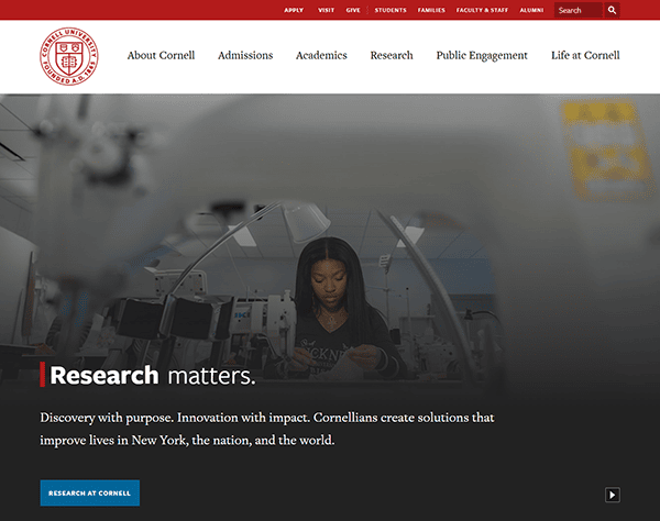 A student works in a science lab at Cornell University, surrounded by lab equipment, while text emphasizes the importance of research and innovation featured on top school websites.