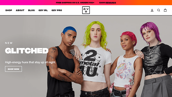 Four people with brightly colored hair and trendy outfits pose in front of a white background featuring "NEW GLITCHED" and a "Shop Now" button—perfect inspiration for the best small business websites.