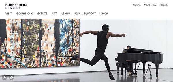 A dancer leaps in front of a colorful artwork while a pianist plays a grand piano in a modern gallery space at the Guggenheim Museum, an institution renowned for its inspiring museum website design.