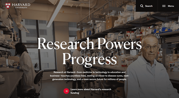 A laboratory with scientific equipment, two researchers in lab coats, and a text overlay reading “Research Powers Progress” showcases Harvard University’s commitment to innovation—an example of the best school websites in action.