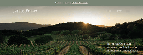 A vineyard landscape at sunset with rows of grapevines, hills in the background, and Joseph Phelps Vineyards branding at the top—an inspiring scene for those seeking standout winery website design.