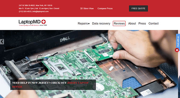 A person is expertly repairing a laptop, its internal components delicately exposed. On LaptopMD's website, featuring options like Repairs and Reviews, you'll find top-notch Laptop Repair Services among the Best Laptop Websites available.