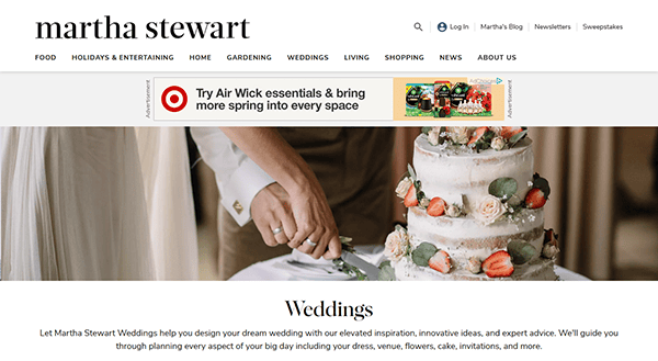 A close-up of two people cutting a decorated wedding cake, featured on the Martha Stewart Weddings site for wedding website ideas.