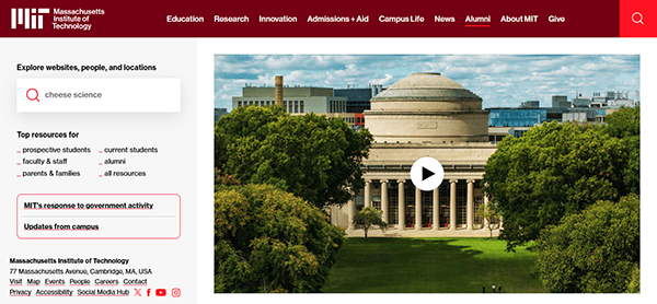 Screenshot of the MIT website homepage, one of the top school websites, featuring a search bar, navigation menu, and a central image of the MIT dome and main building surrounded by trees.