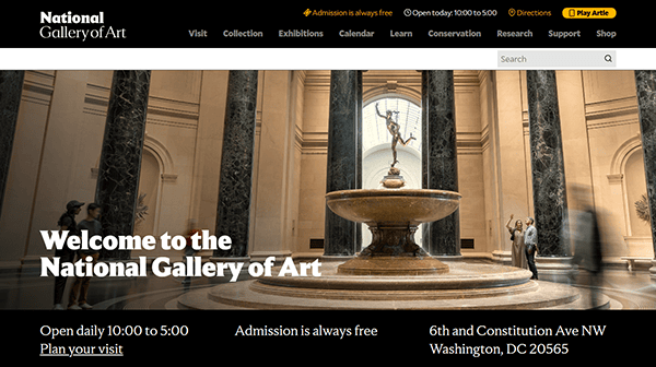 The interior lobby of the National Gallery of Art, often highlighted on the best museum websites, features a central fountain, tall columns, and a statue under a domed skylight.