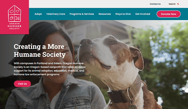 A person sits outside with a large, relaxed dog. The banner reads “Creating a More Humane Society,” highlighting pet adoption info from the Oregon Humane Society and navigation buttons to one of the best pet adoption websites.