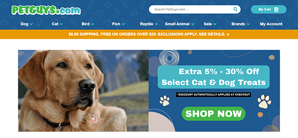 Screenshot of PetGuys.com homepage, one of the best pet shop websites, featuring a large dog, site navigation menu, and a banner advertising 5%-30% off select cat and dog treats with a "Shop Now" button.
