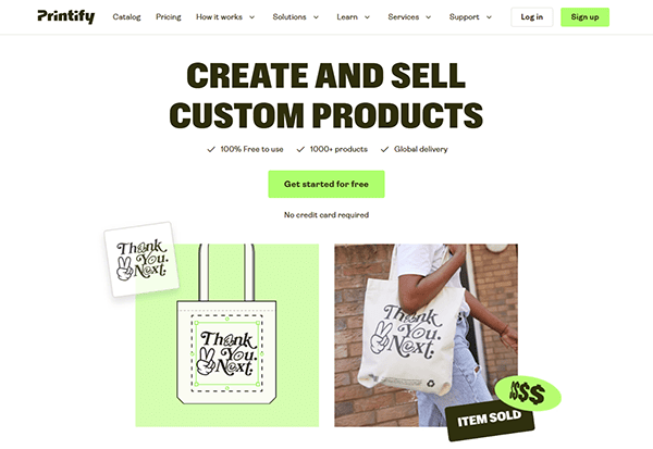 Printify website homepage showing promotion to create and sell custom products, featuring a "Thank You, Next" tote bag and highlighting its reputation among the best T-shirt design websites with a "Get started for free" button.