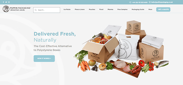 Assorted fresh foods displayed with Puffin Packaging boxes and bags on a white surface; perfect inspiration for small business websites, with the website header and navigation visible at the top.