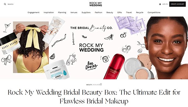 Screenshot of the Rock My Wedding website—one of the best wedding websites—showing a Bridal Beauty Box promotion with beauty products, a woman holding a yellow bow, and a headline for flawless bridal makeup.