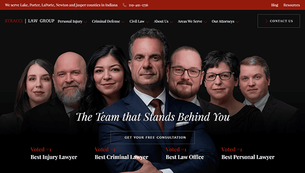 Six professionally dressed individuals stand in a row against a dark background, representing the Stracci Law Group—showcased as one of the best personal injury websites—with award titles displayed below them.