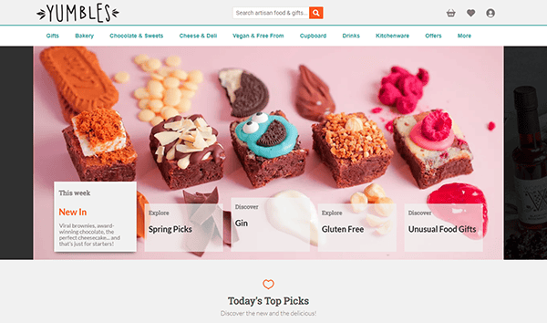 Screenshot of Yumbles website homepage displaying featured treats, including decorated brownies and cookies, with a business website design that highlights navigation for food gifts and dietary preferences—perfect inspiration for small business websites.